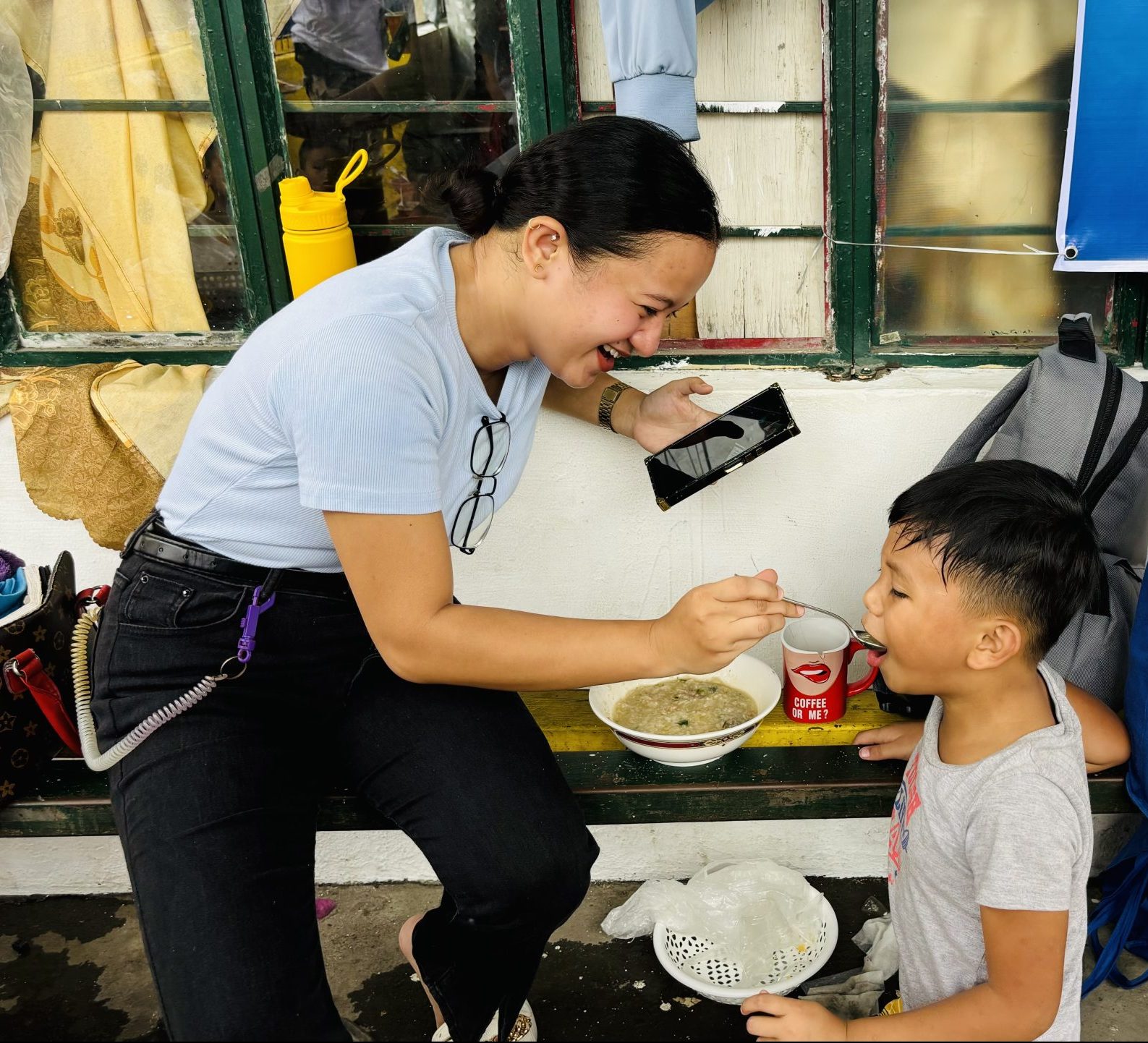 Feeding the children living in extreme poverty [Palanyag, Paranaque, Philippines]